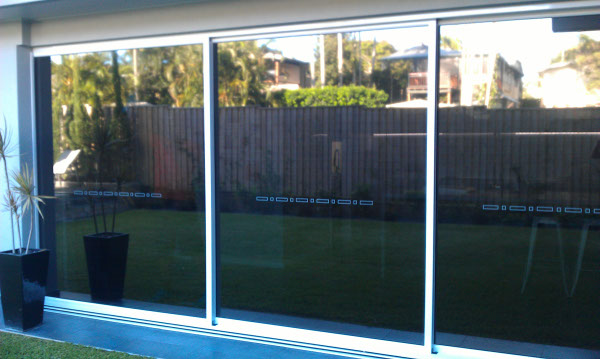 Cannon Hill Brisbane house hallway living area windows tinted close up view from outside