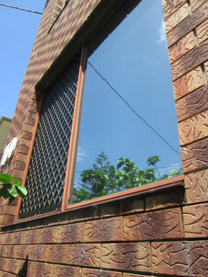 Gold Cost apartment window tinted with optitune reflective exterior window film