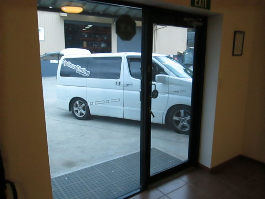 inside an office with reflective window tint installed on entrance door