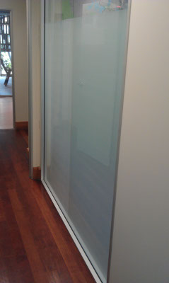 office window side view after frosted window glass film installed