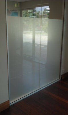 office windows after frosted white film installed for privacy