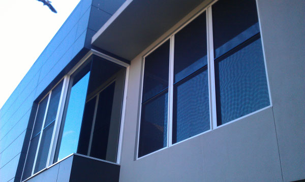 outside view Cannon Hill Brisbane home bedroom windows tinted with black solar control privacy film