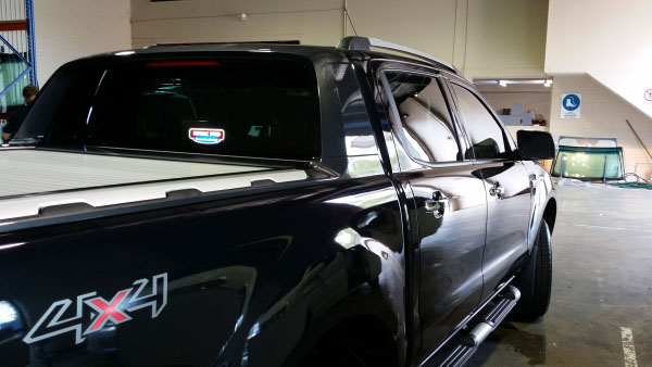 rear view black colour Ford Ranger pick up truck window tinted onsite in Logan City Brisbane Australia