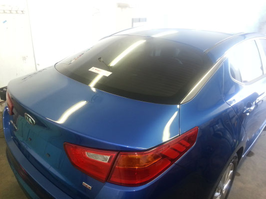 rear view blue colour Kia Optima midsize sedan tinted in Brisbane by optimus tinting solutions