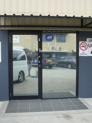 reflective window tint installed at front door of office in Carindale Brisbane Queensland