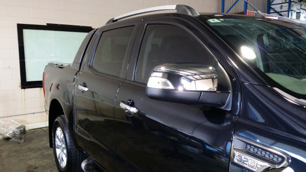 side view black colour Ford Ranger pick up truck window tinted onsite in Logan city Brisbane Australia