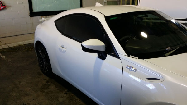 side view white colour Toyota 86 Series sports car windows tinted