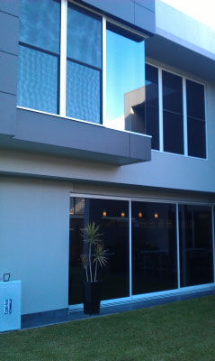 view from outside Cannon Hill Brisbane house ground floor and top floor all windows tinted